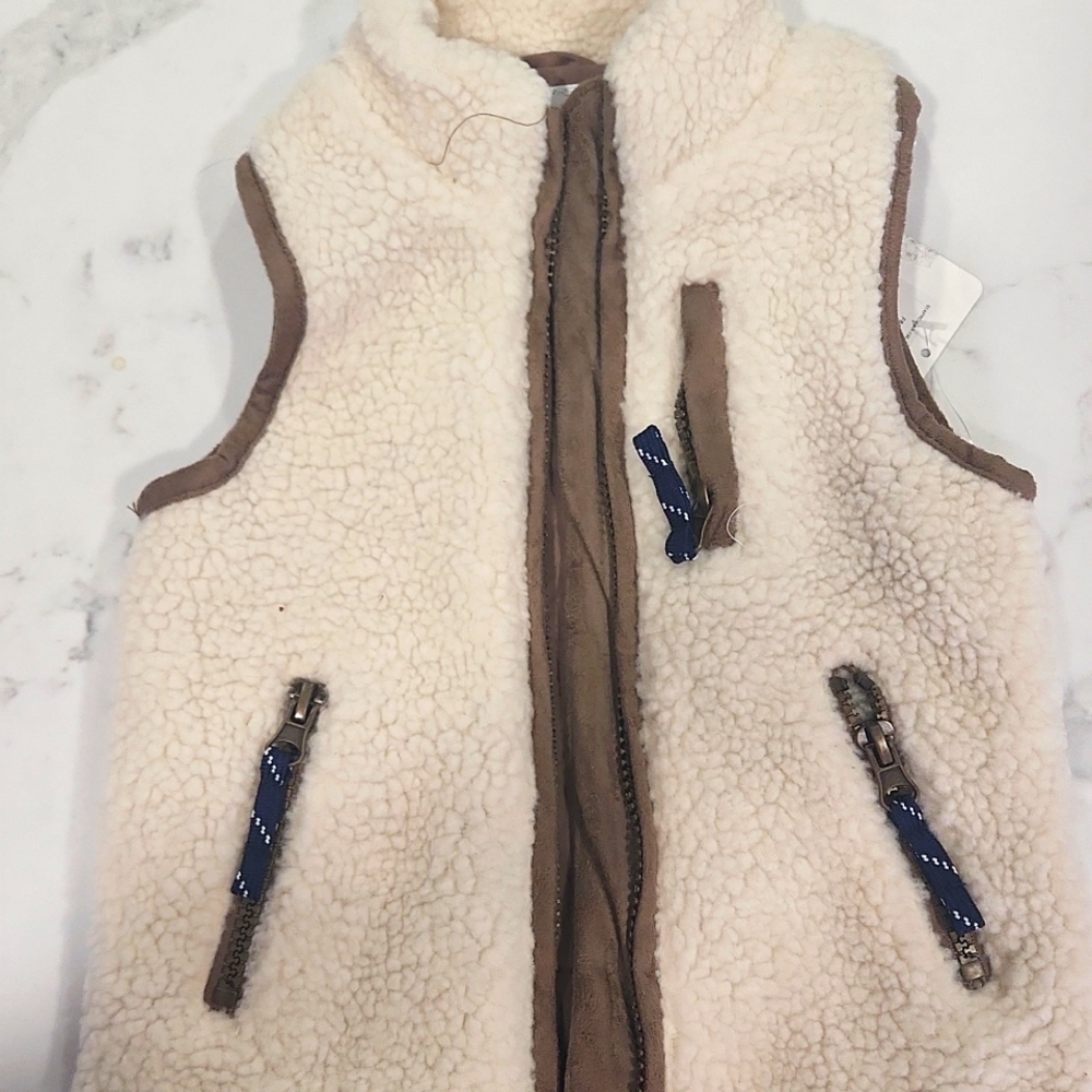 Starting out, ivory  18m zip up vest.